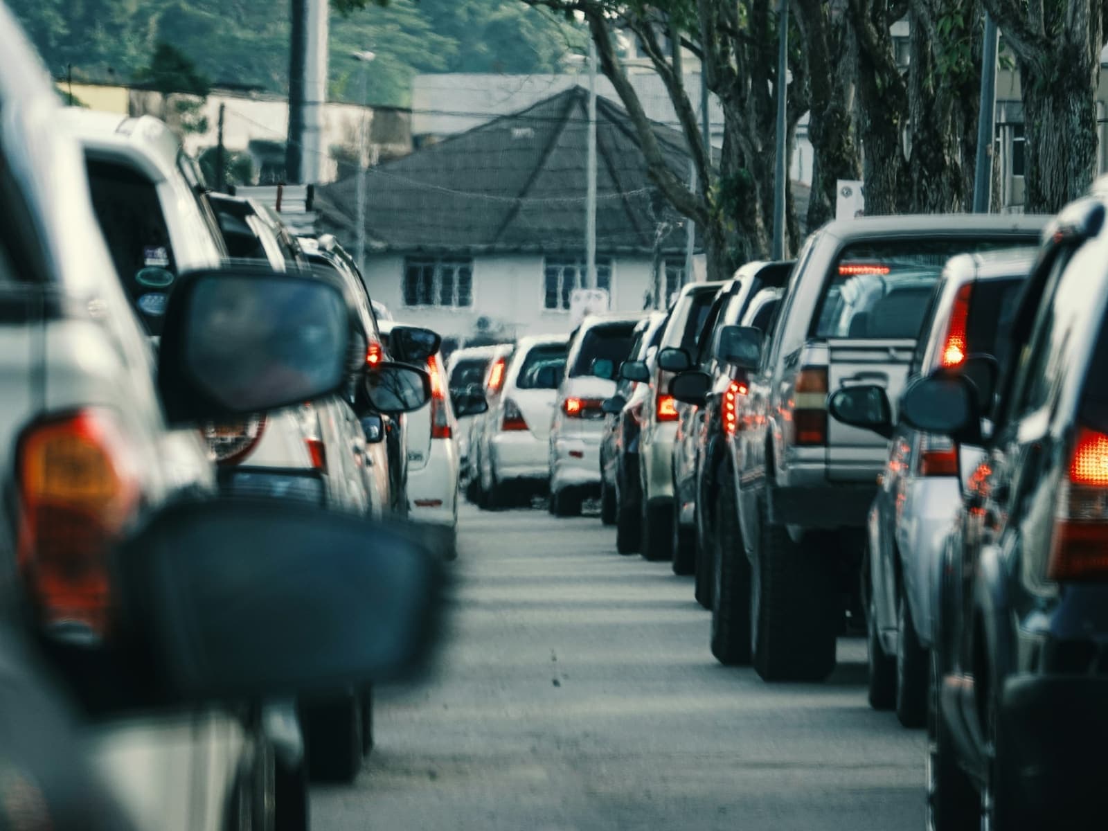 A long line of cars in a traffic jam on a city street