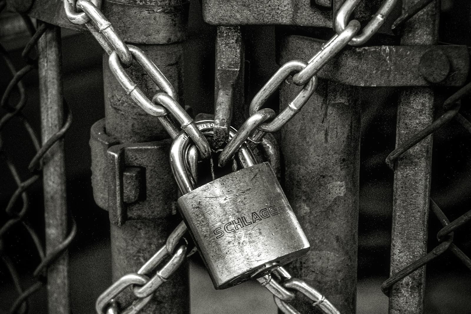 Chains and a padlock on a metal gate